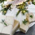 white holiday presents under tree; white gifts; Christmas gifts under tree