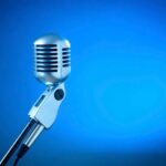 old school microphone with blue background