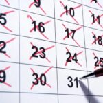 calendar with red pen marking numbers off