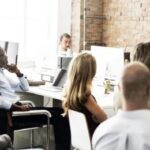 presentation in front of large group; work presentation; manager speaking to employees