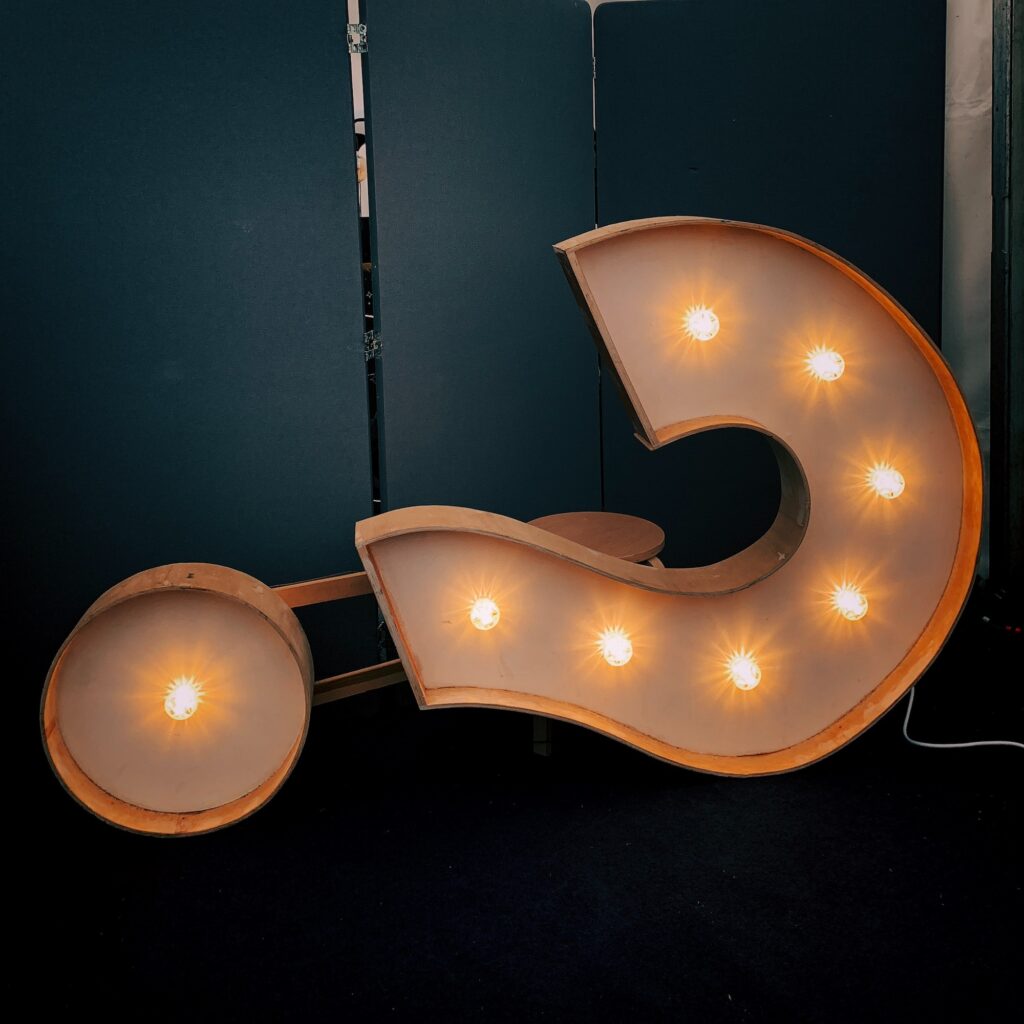 Question mark with lights on the ground
